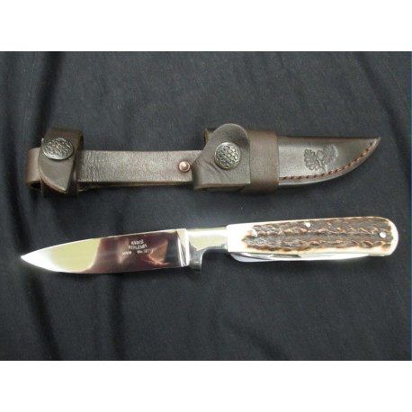 Pevný lovecký nůž s párákem a pilkou v rukojeti